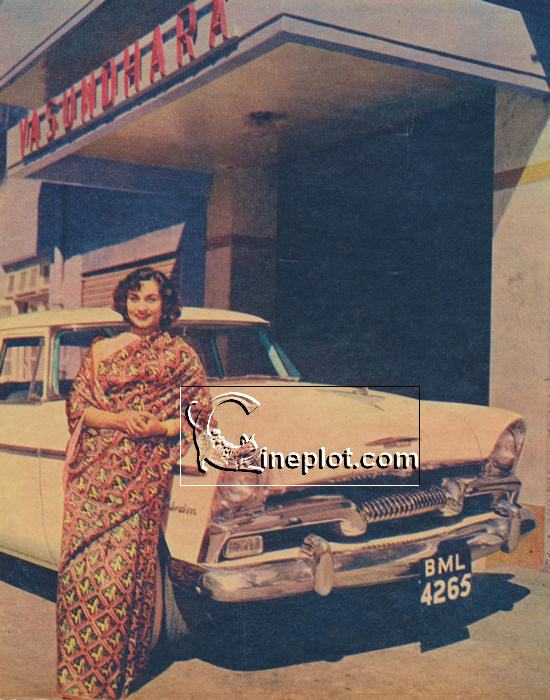 Nadira - alongside her Plymouth at the entrance to "Vasundhara," where she stays.